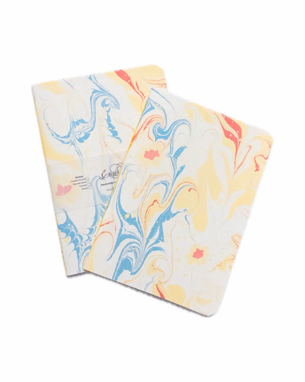 Two sheets of marbled paper with swirling patterns in yellow, blue, red, and white.